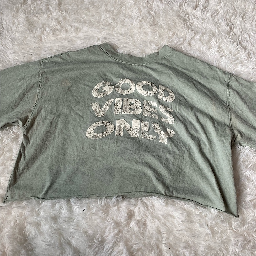 light green graphic tee, in the size child medium!